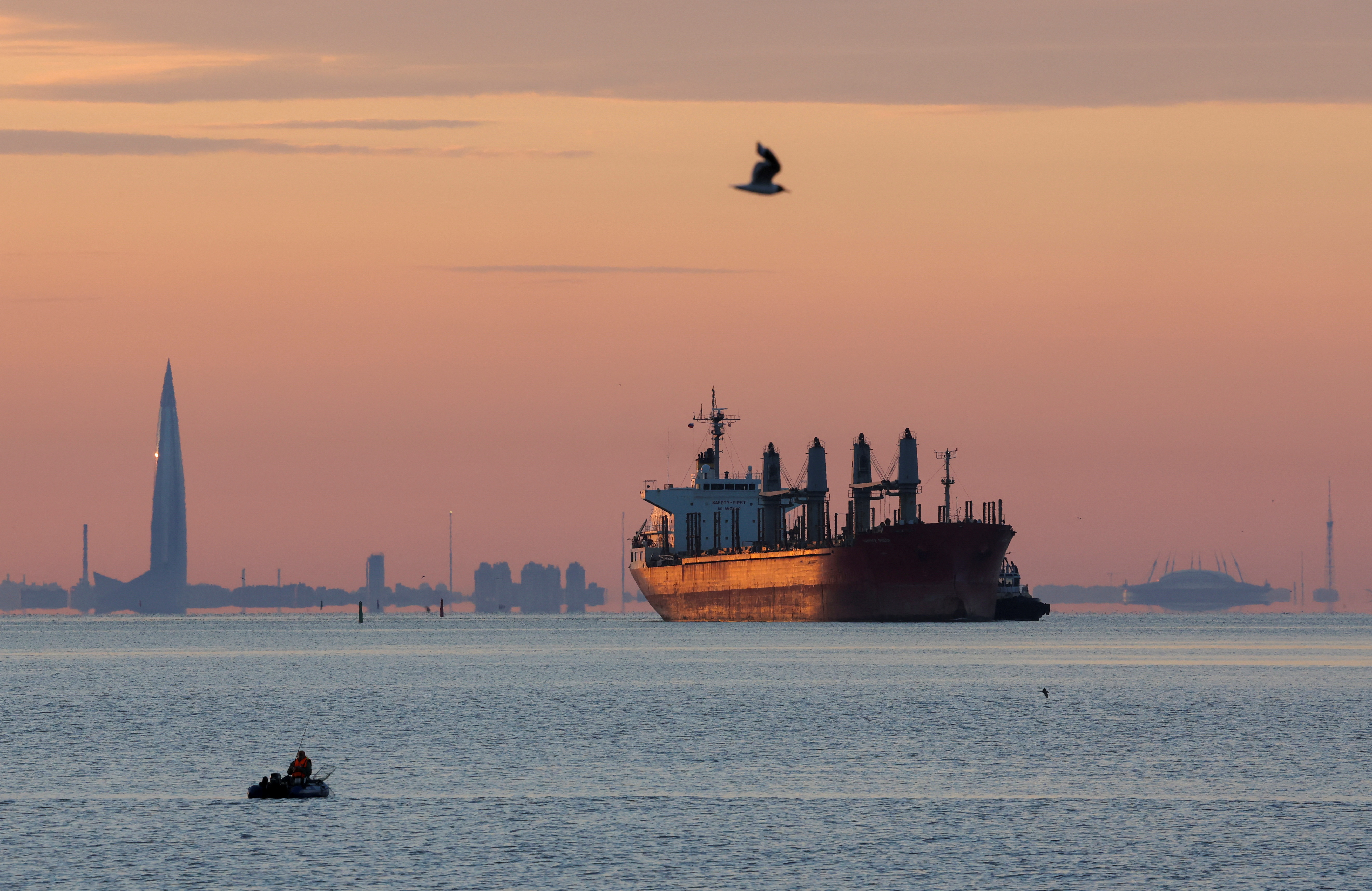 A cargo ship moves towards a port in St Petersburg