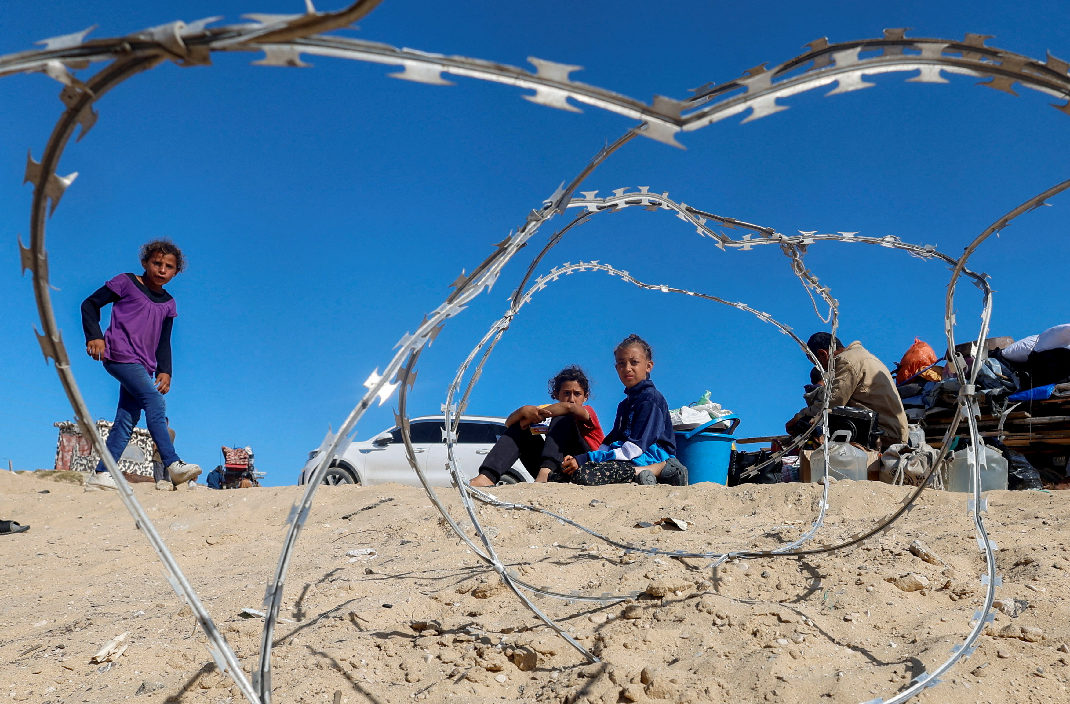 Palestinians evacuate after Israeli forces launched a ground and air operation in the eastern part of Rafah