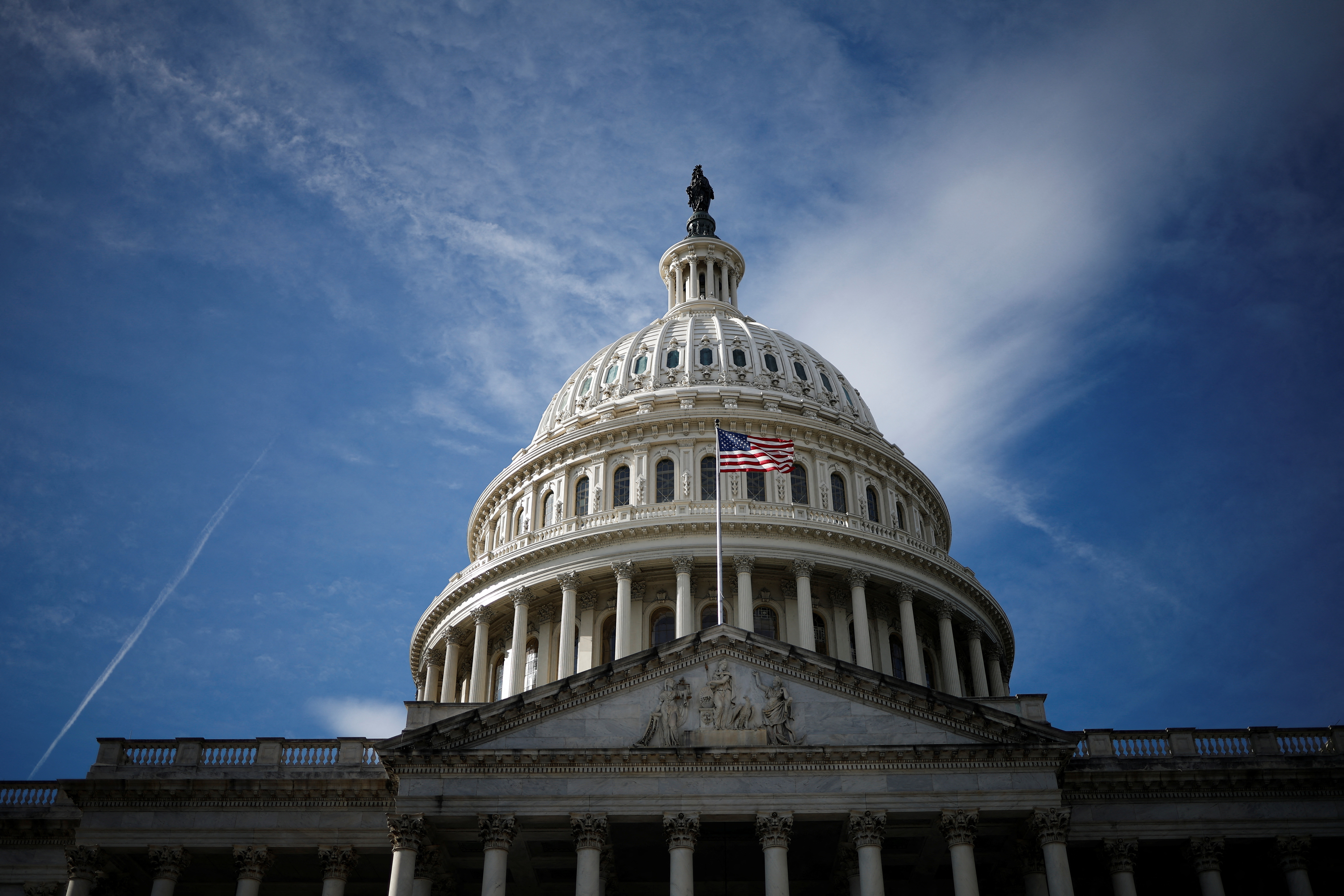 A U.S. flag is mounted on the U.S. Capitol in Washington, U.S
