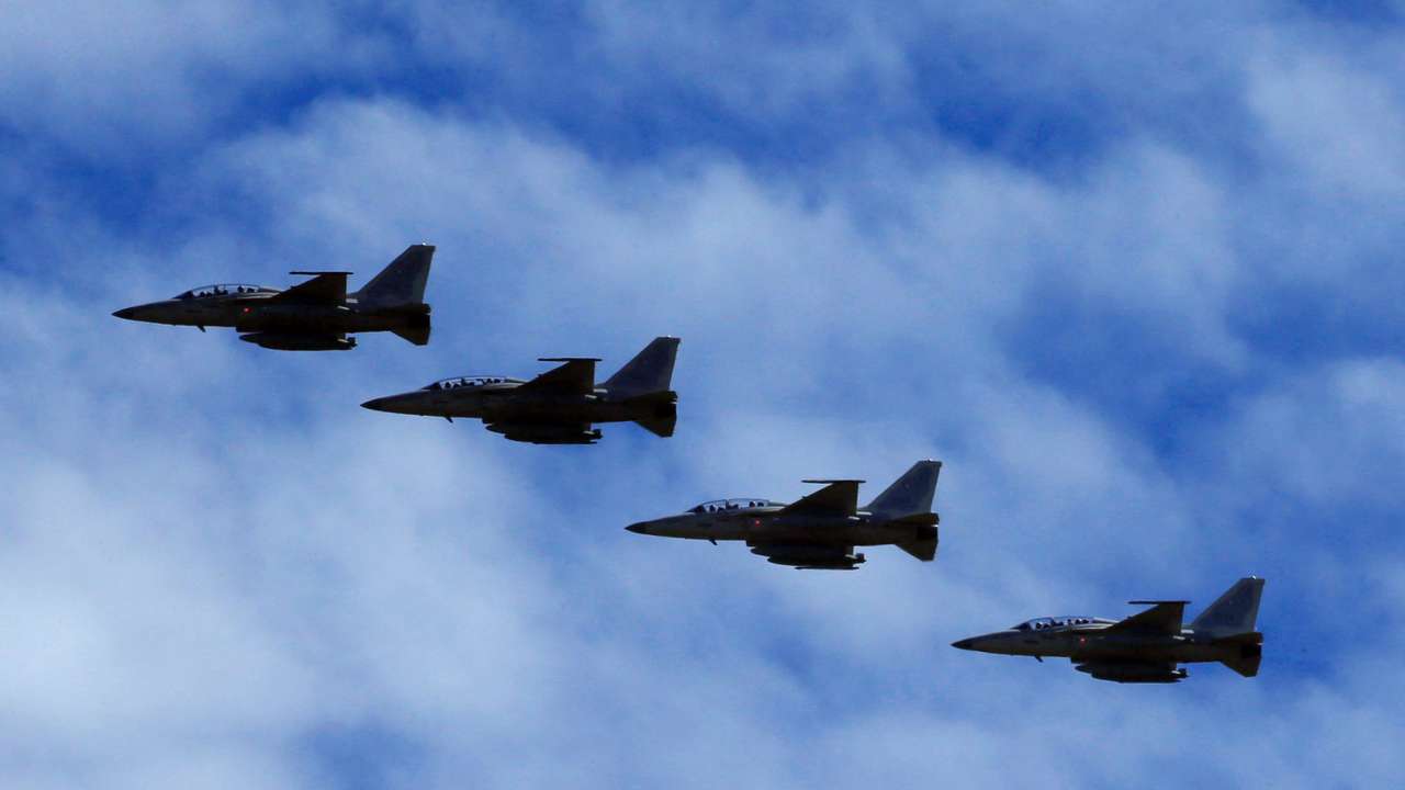FILE PHOTO: FA-50 fighter jets, newly purchased from South Korea, are escorted by fighter jets in the sky upon arrival in Clark air base, Angeles city, Pampanga province, north of Manila