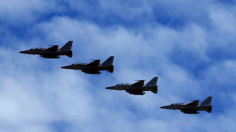 FILE PHOTO: FA-50 fighter jets, newly purchased from South Korea, are escorted by fighter jets in the sky upon arrival in Clark air base, Angeles city, Pampanga province, north of Manila