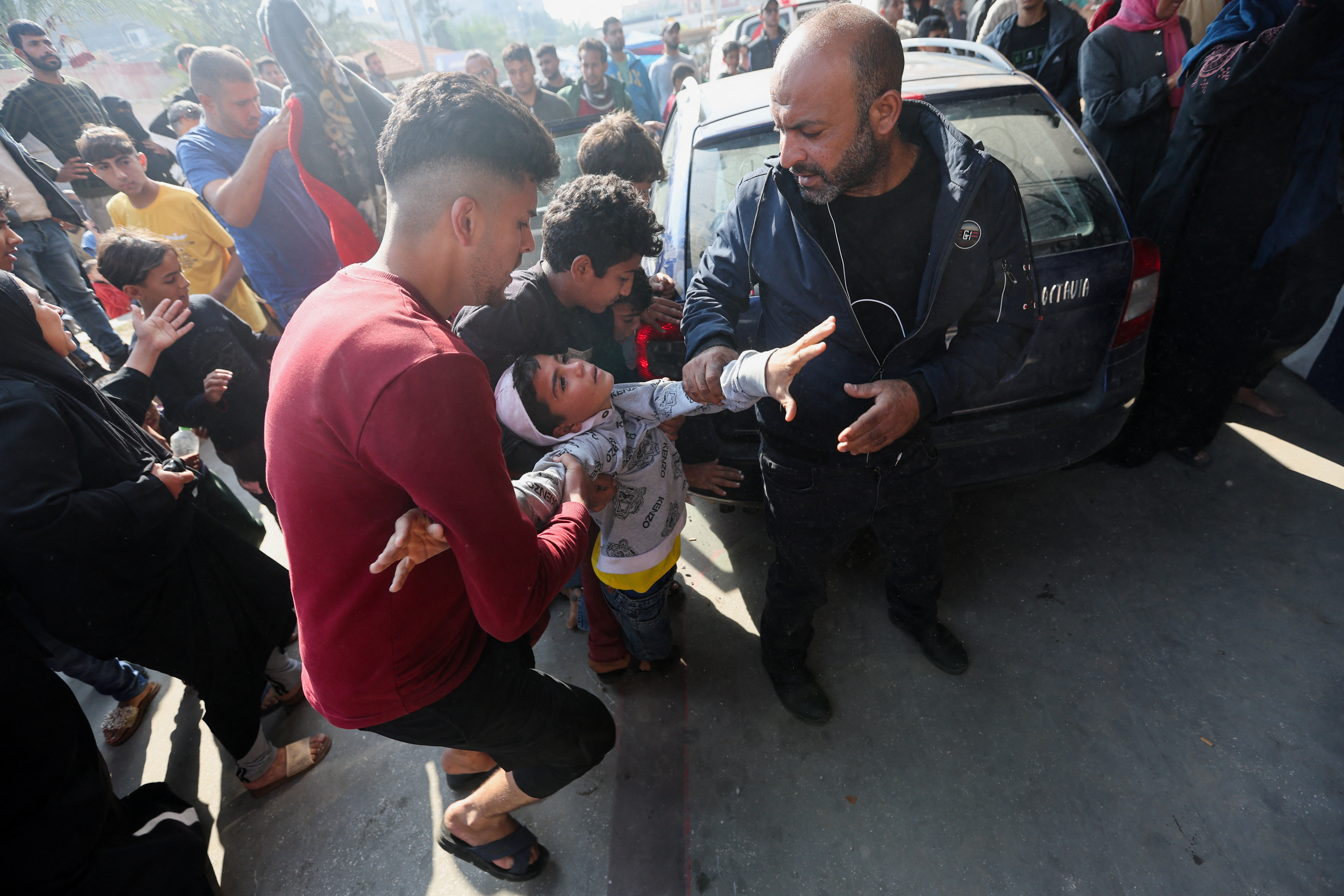 Wounded Palestinians rushed into hospital following Israeli strikes