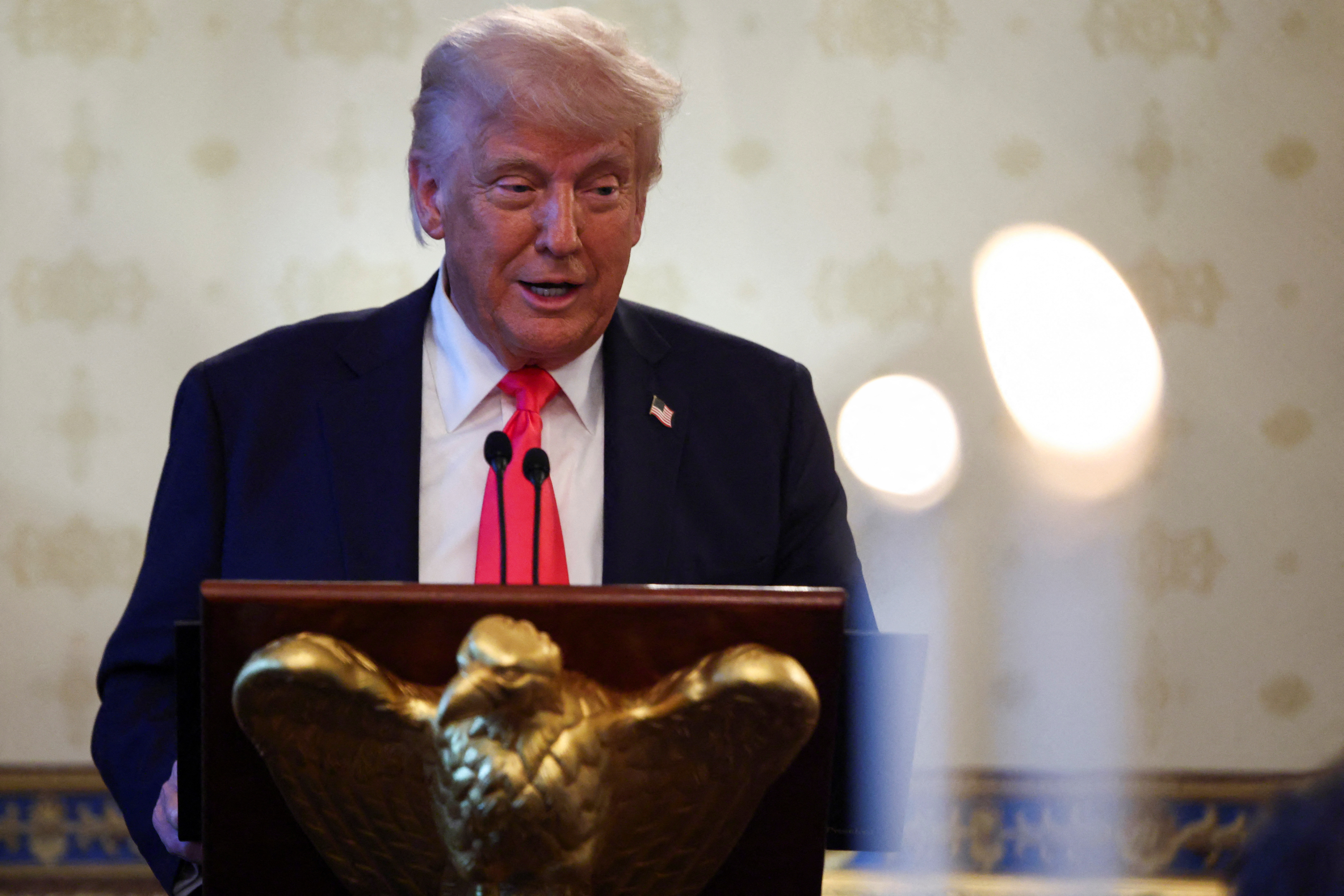 U.S. President Donald Trump attends a prayer service and dinner ahead of Easter Sunday, at the White House in Washington