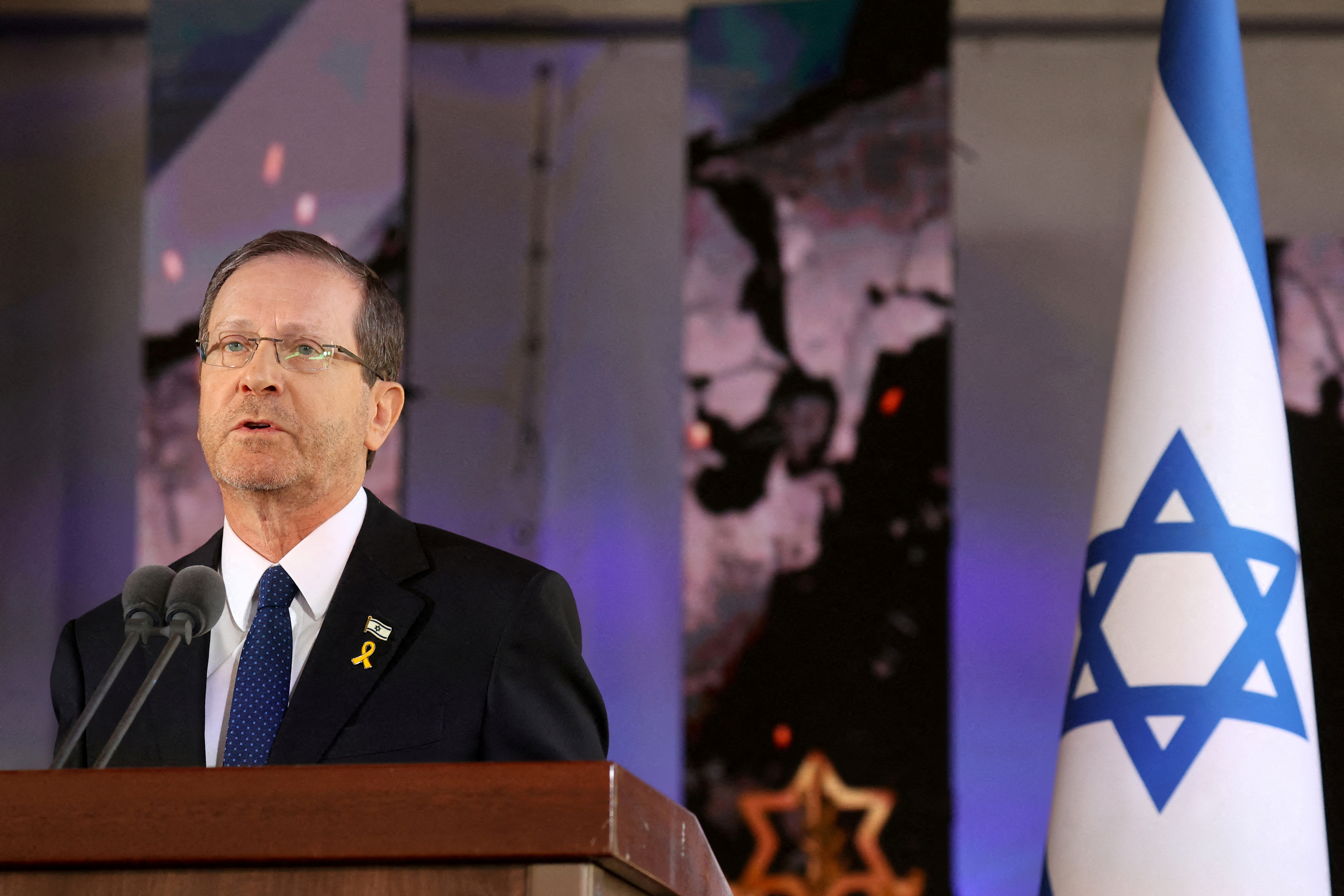 FILE PHOTO: Israel's President Isaac Herzog takes part in a memorial ceremony of the Hamas attack on October 7, in Jerusalem