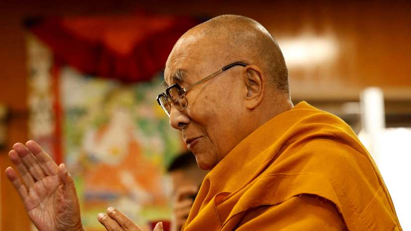 FILE PHOTO: Tibetan spiritual leader, the Dalai Lama, offers blessings to his followers at his Himalayan residence in Dharamshala