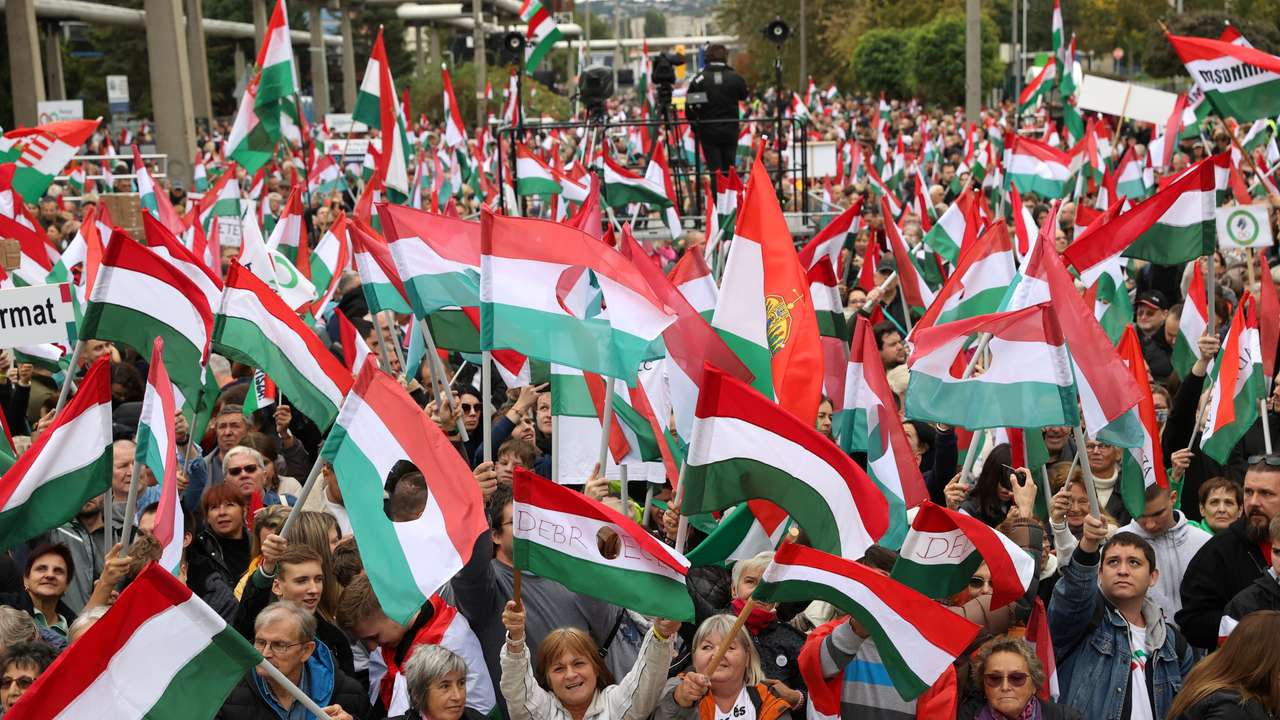 People attend a protest organized by the leading opposition party TISZA, at the public TV building in Budapest