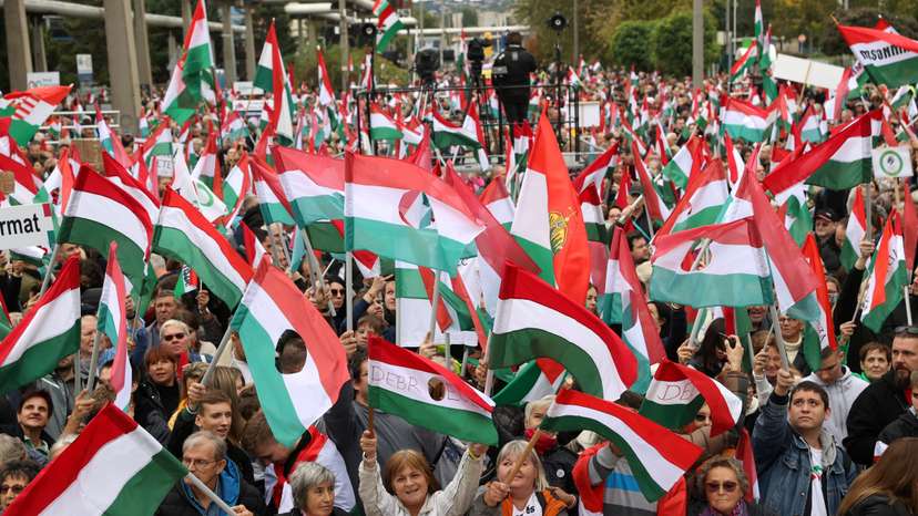 People attend a protest organized by the leading opposition party TISZA, at the public TV building in Budapest