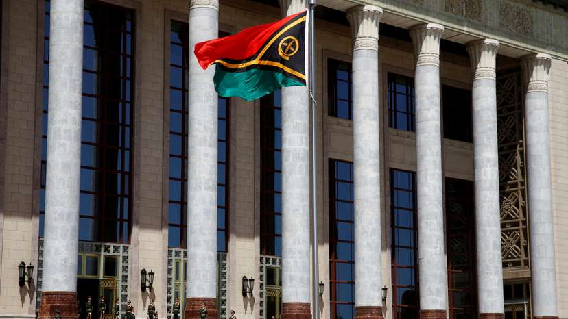 FILE PHOTO: A Vanuatu flag flutters outside the Great Hall of the People in Beijing