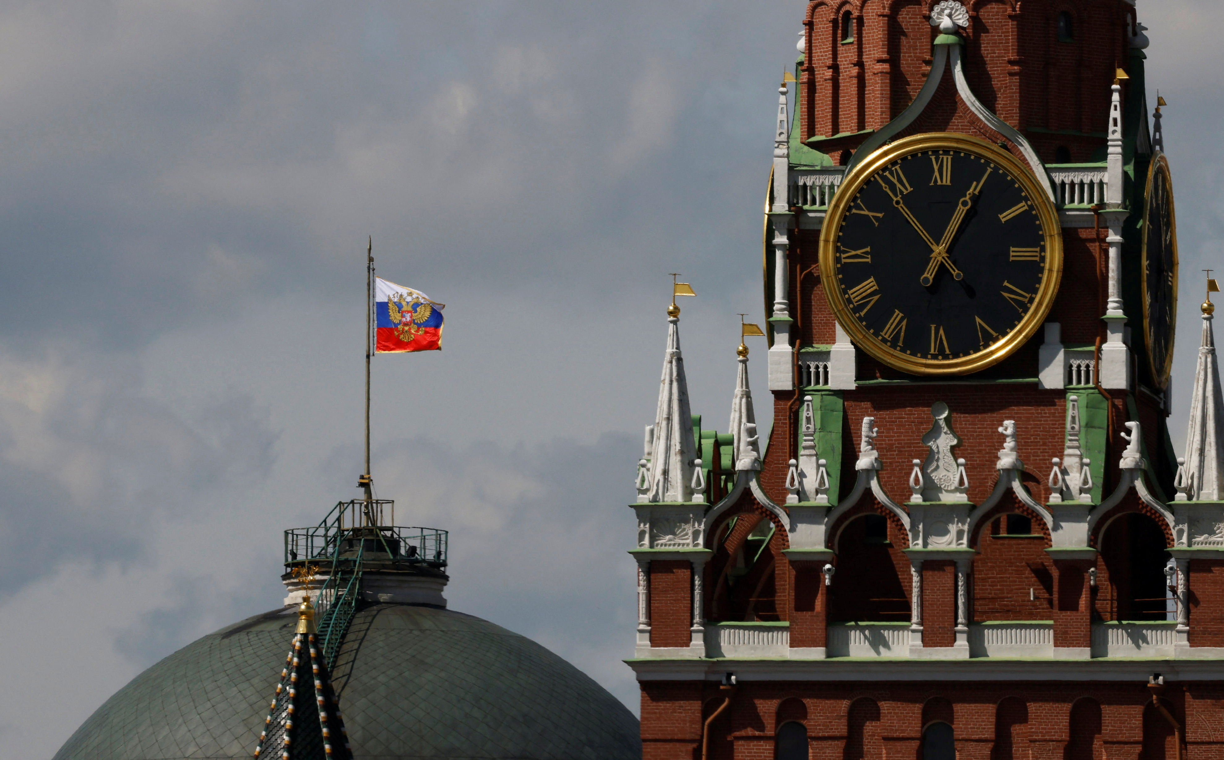 FILE PHOTO: The Russian flag flies on the dome of the Kremlin Senate building in Moscow