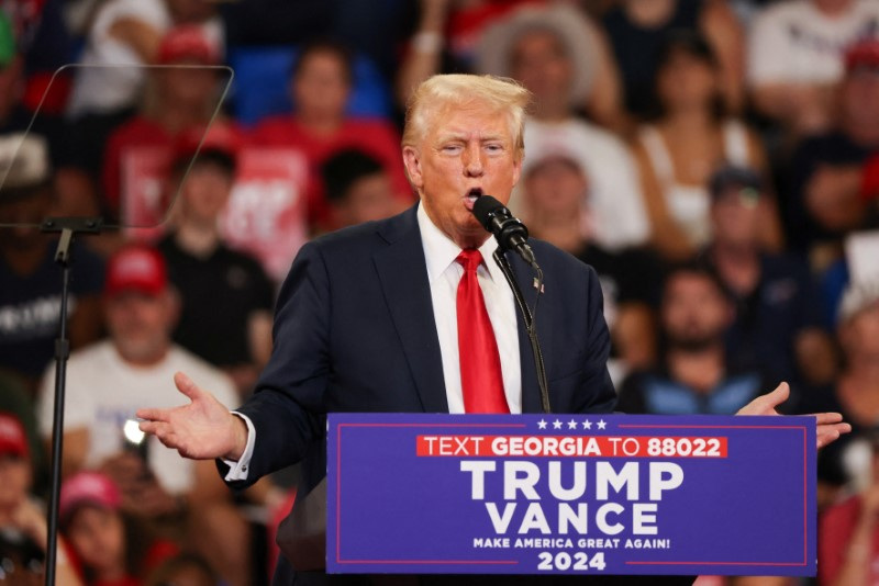Republican presidential nominee and former U.S. President Donald Trump and his running mate JD Vance hold a campaign rally in Atlanta, Georgia