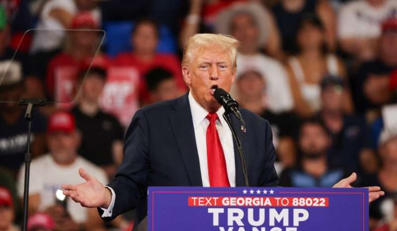 Republican presidential nominee and former U.S. President Donald Trump and his running mate JD Vance hold a campaign rally in Atlanta, Georgia