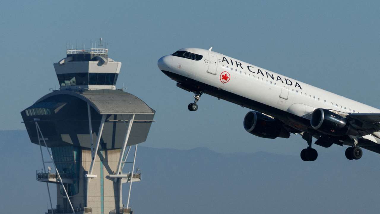 FILE PHOTO: Commercial airliners take-off from Los Angeles International Airport