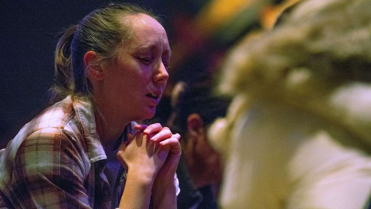 Worshipers at Blackhawk Church gather to pray for victims and survivors of a shooting in Madison