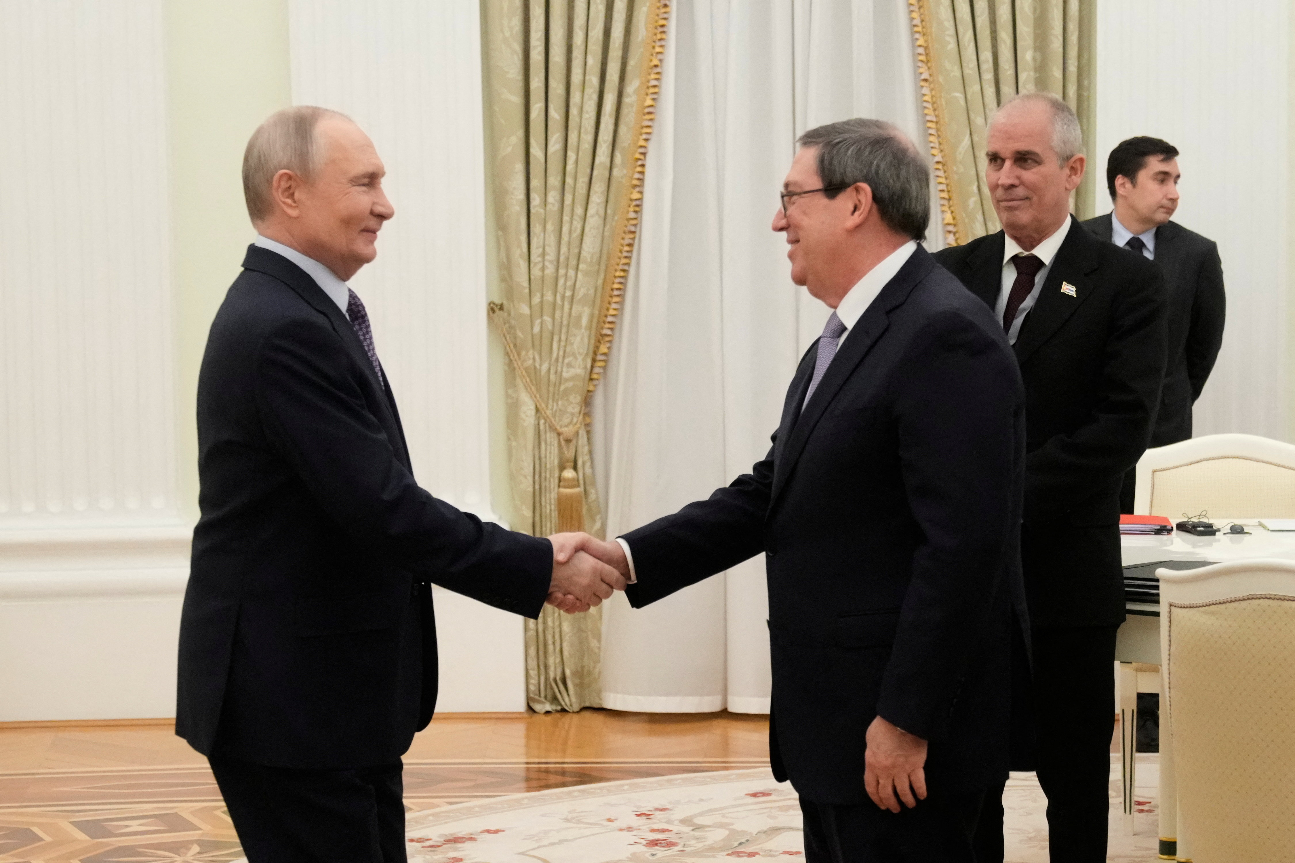 Russian President Vladimir Putin and Cuban Foreign Minister Bruno Rodriguez Parrilla attend a meeting at the Senate Palace of the Kremlin in Moscow