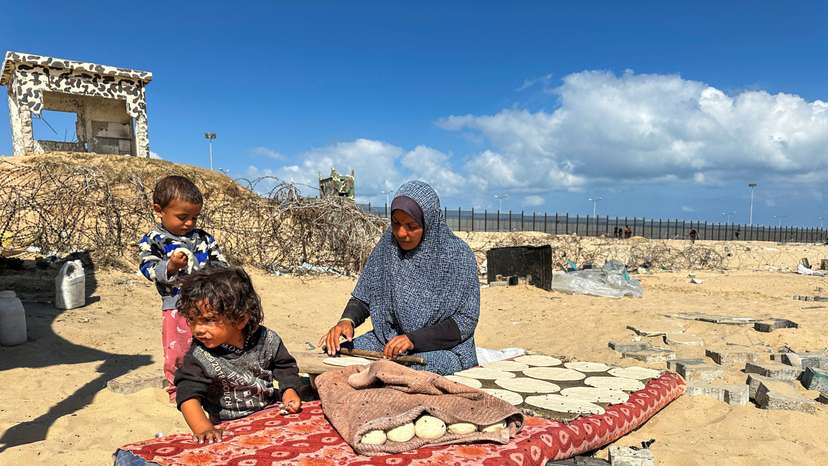 Displaced Palestinians take shelter at the border with Egypt, during an Israeli military operation, in Rafah