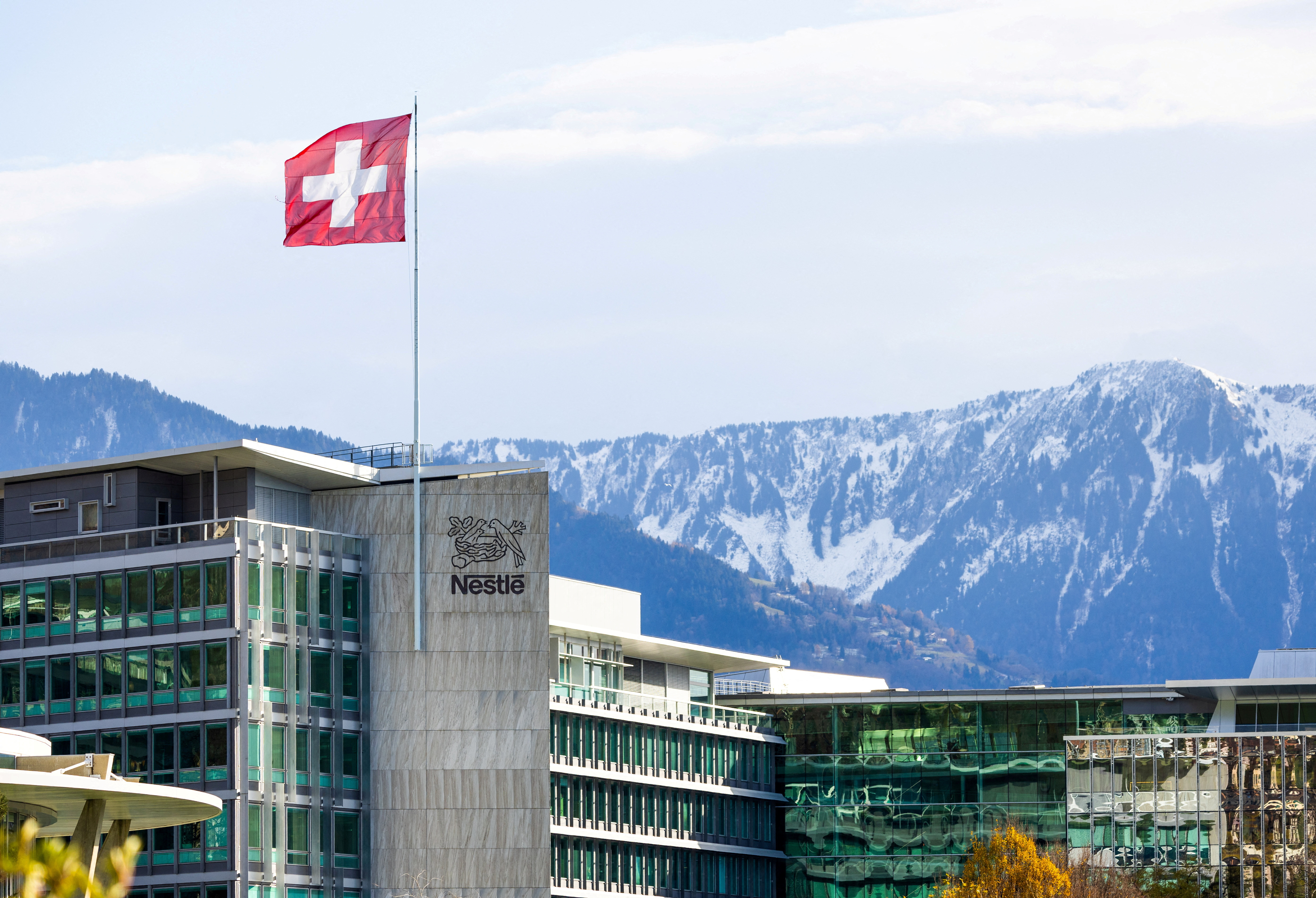 FILE PHOTO: A Swiss flag flutters on the headquarters of Nestle in Vevey