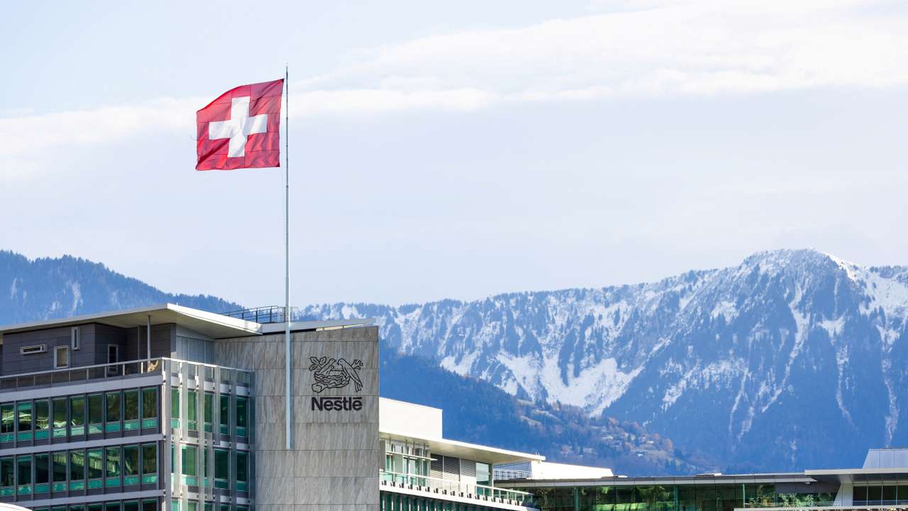 FILE PHOTO: A Swiss flag flutters on the headquarters of Nestle in Vevey