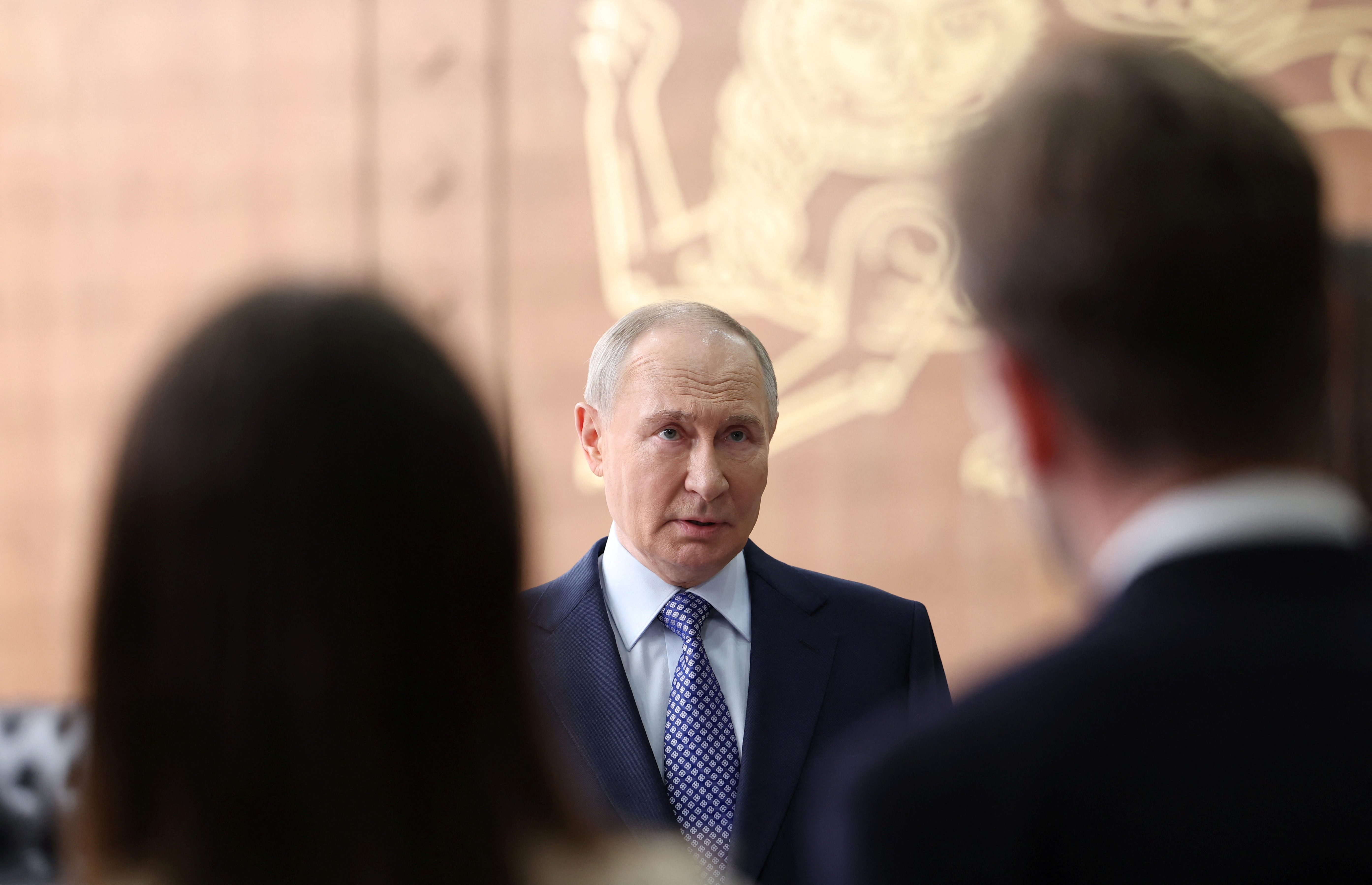 Russia's President Putin speaks with journalists in Moscow