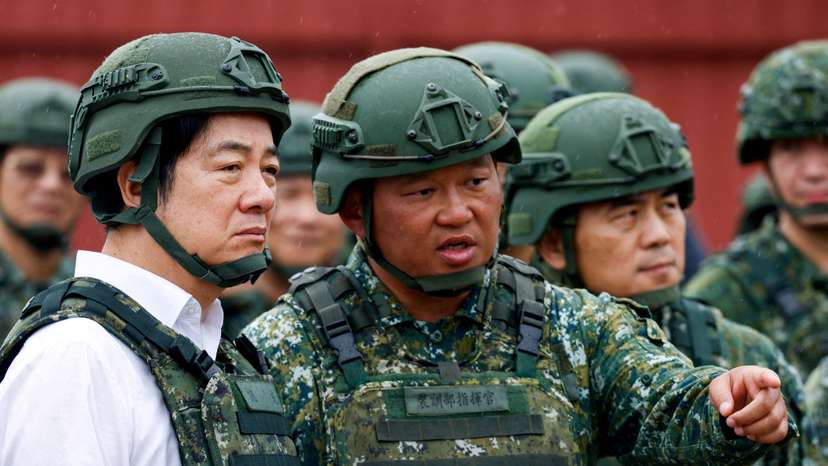 FILE PHOTO: A soldier speaks to Taiwan's President Lai Ching-te in Hsinchu