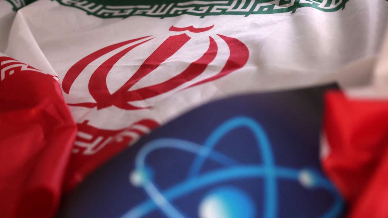 Illustration shows atomic symbol and Iranian flag