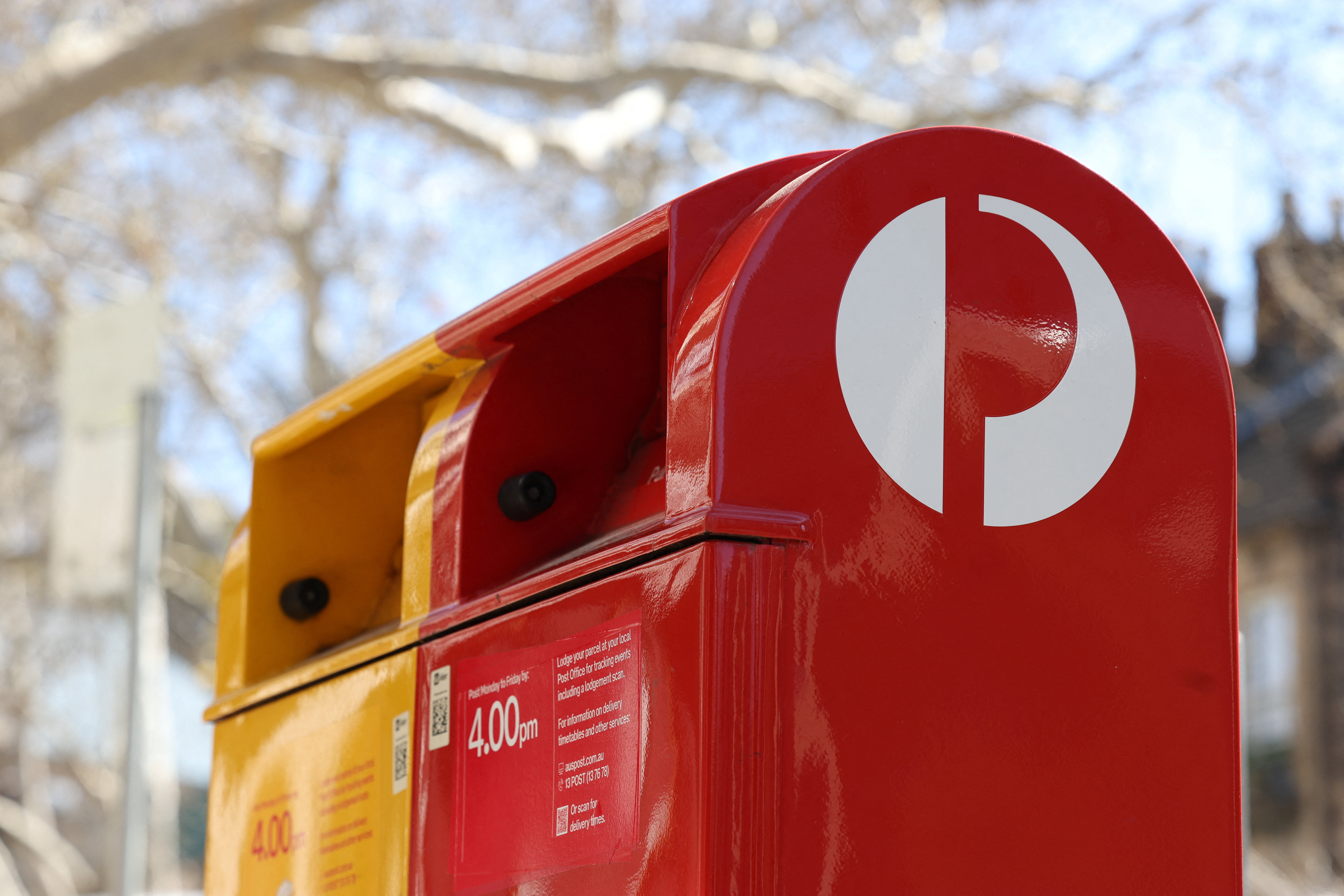 An Australia Post red street posting box stands alongside an express post box in Sydney