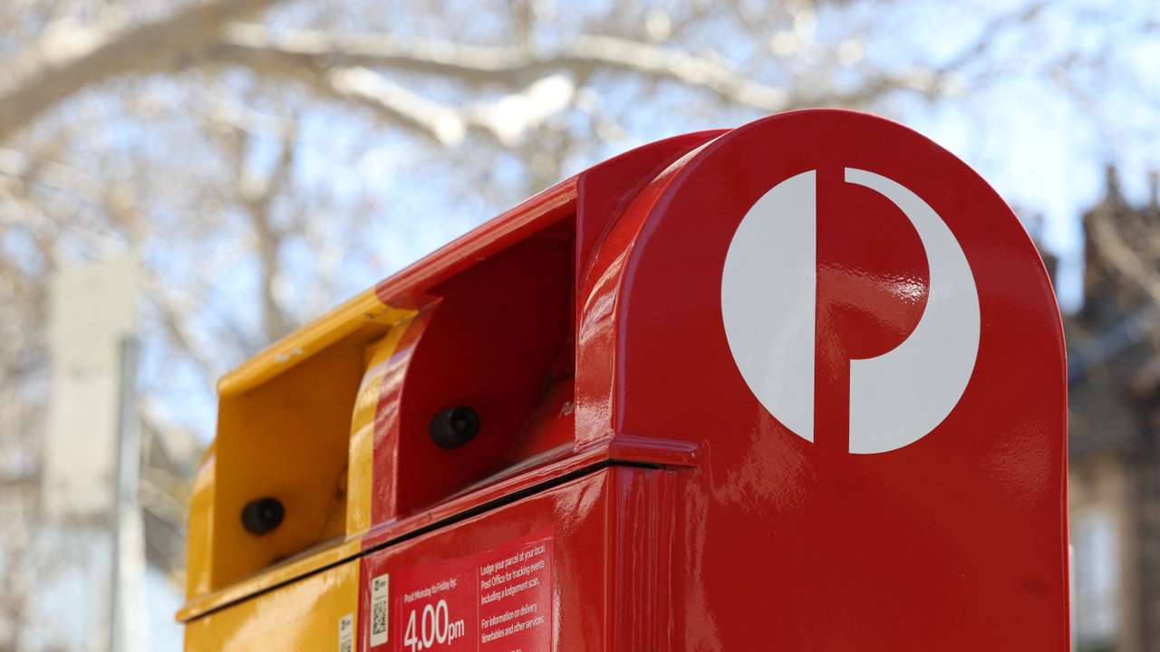 An Australia Post red street posting box stands alongside an express post box in Sydney