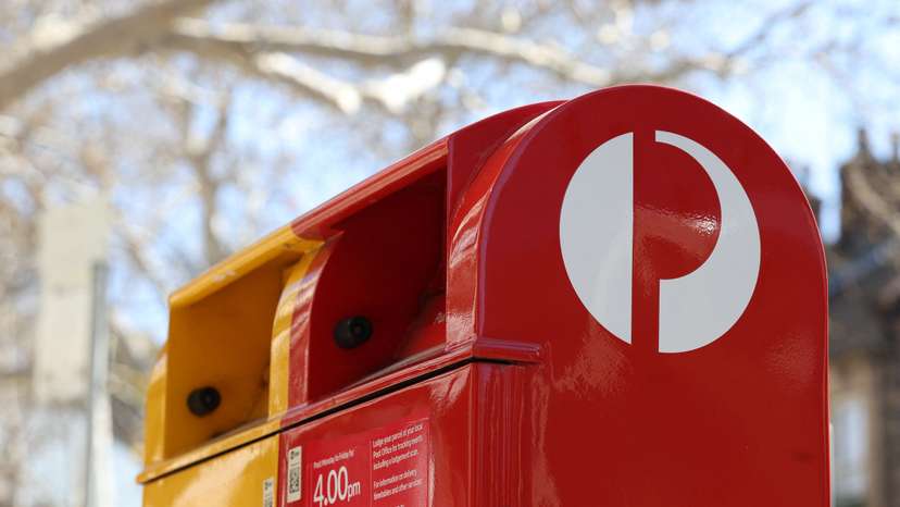 An Australia Post red street posting box stands alongside an express post box in Sydney