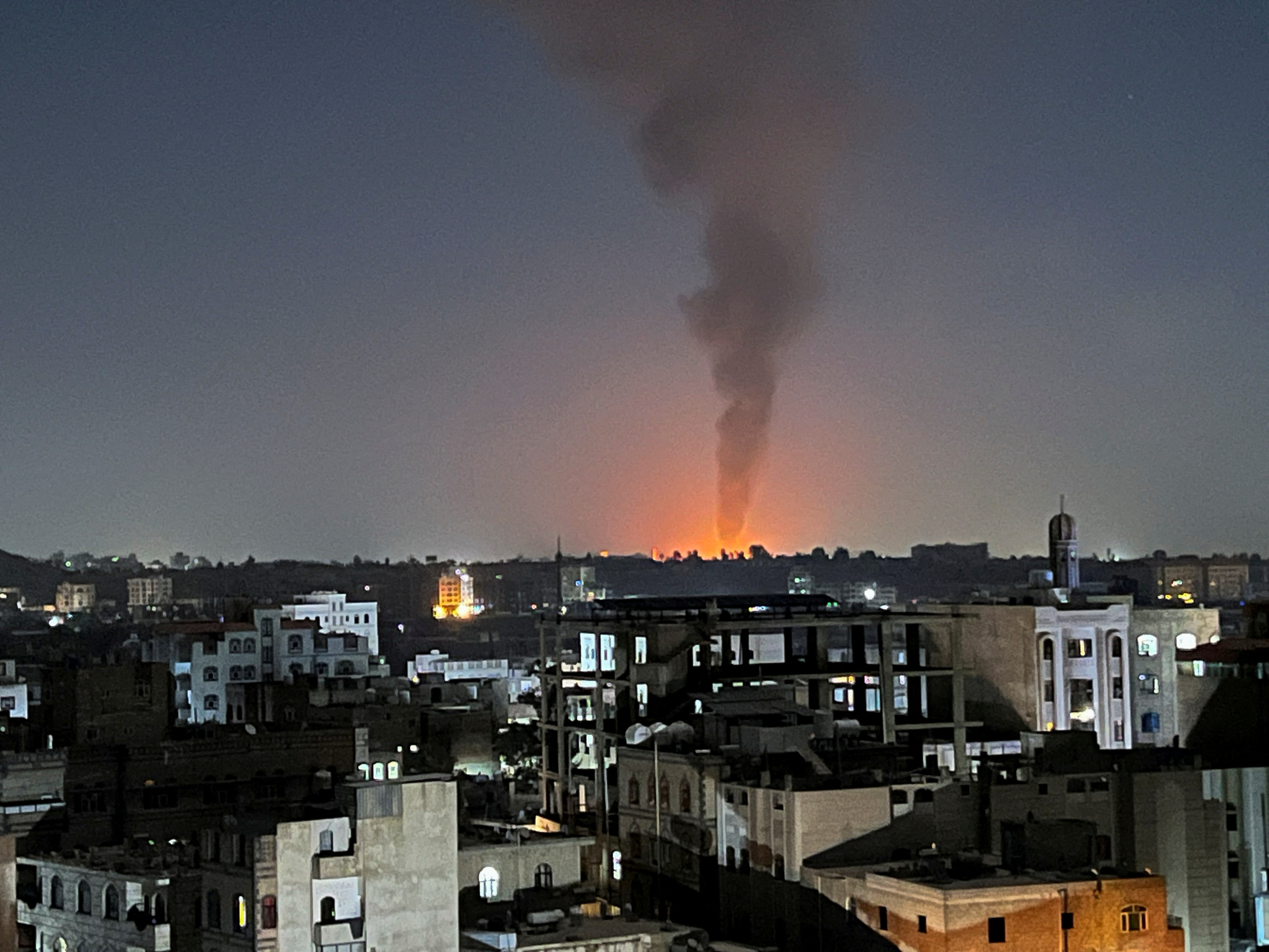 Smoke rises in the sky following U.S-led airstrikes in Sanaa