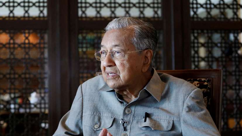 FILE PHOTO: Former Malaysian Prime Minister Mahathir Mohamad speaks during an interview in Putrajaya