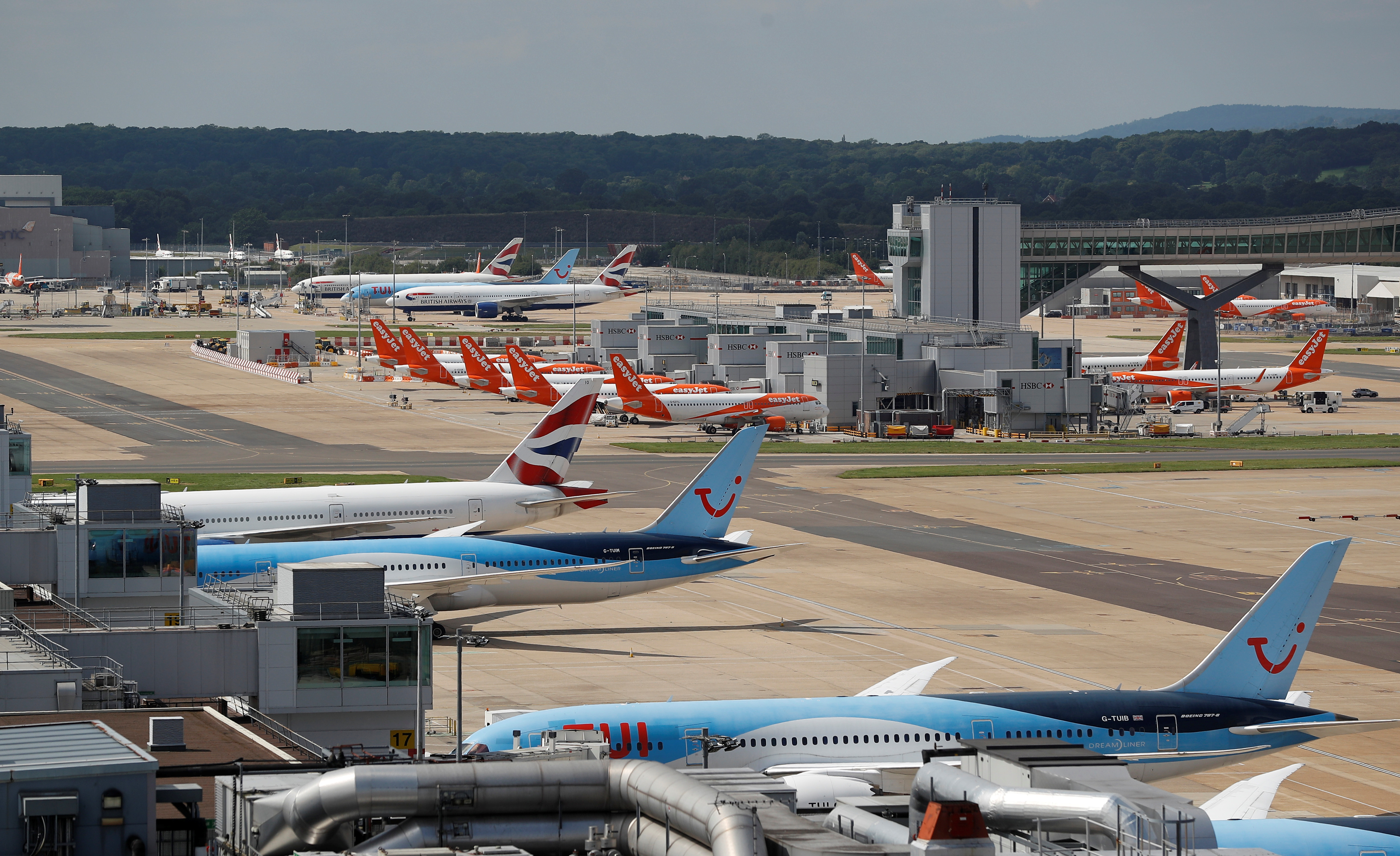 British Airways, Easyjet and TUI aircraft are parked at the South Terminal at Gatwick Airport, in Crawley