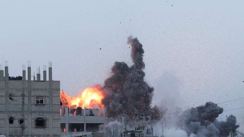 Smoke and flames rise during an Israeli air strike in central Gaza Strip