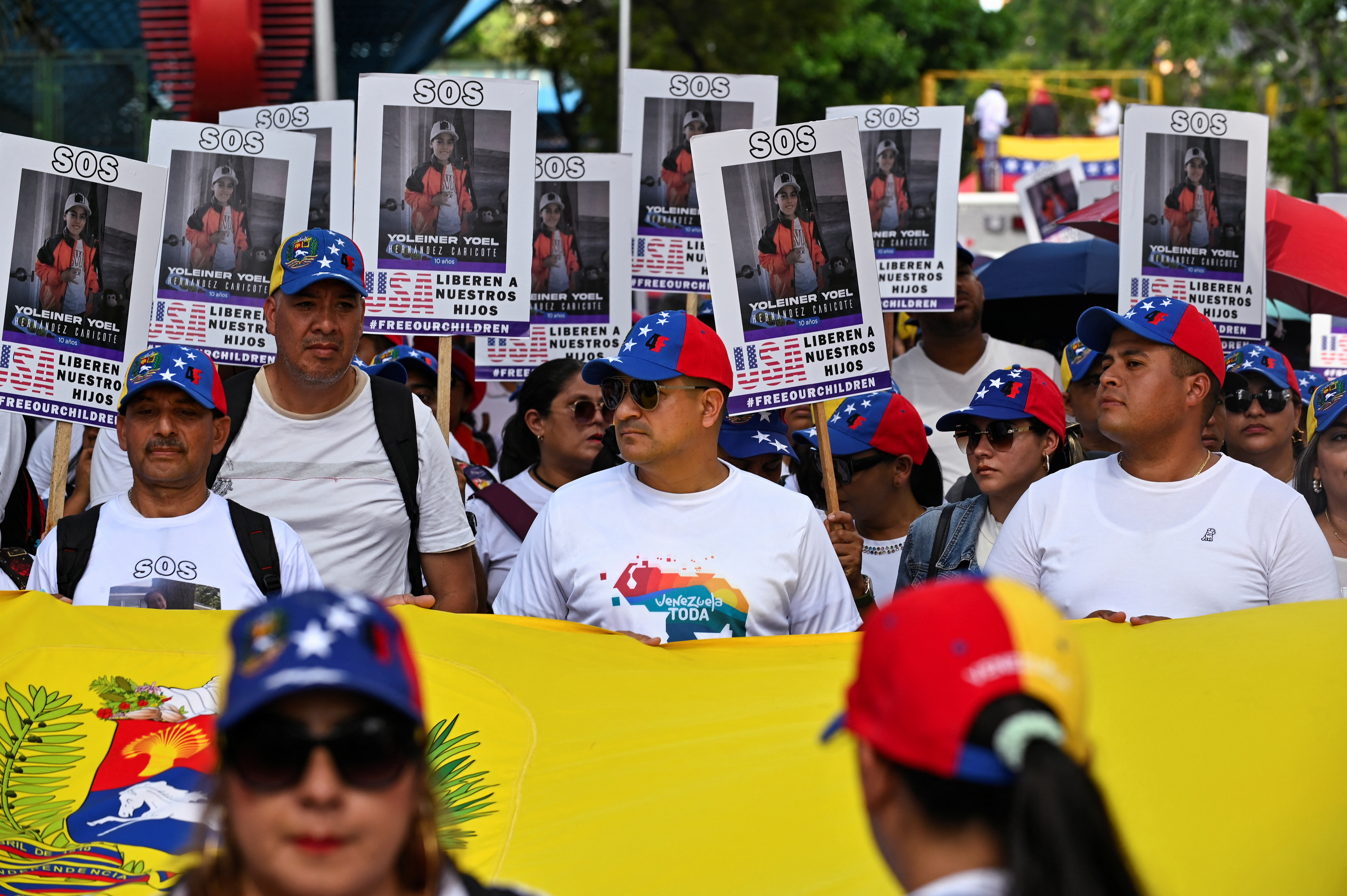 Demonstrators march to demand the return of Venezuelan migrant children after their parents were deported from the U.S., in Caracas