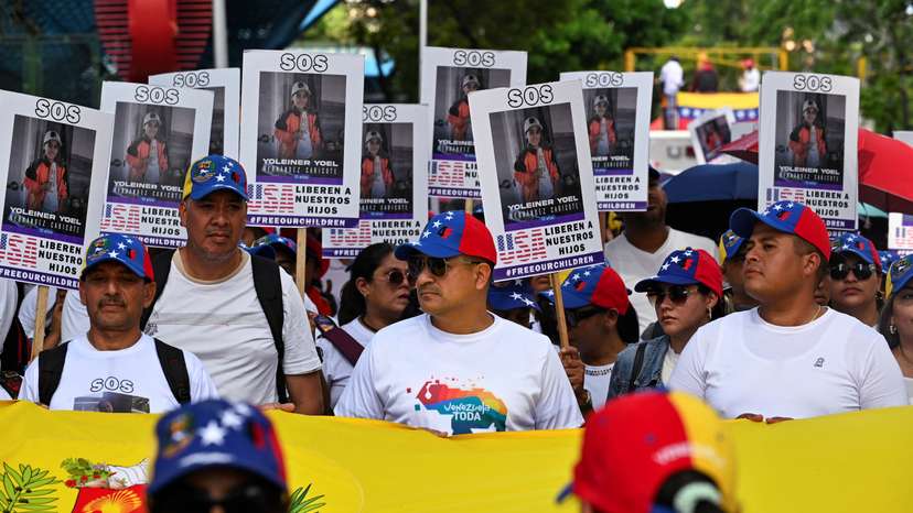 Demonstrators march to demand the return of Venezuelan migrant children after their parents were deported from the U.S., in Caracas