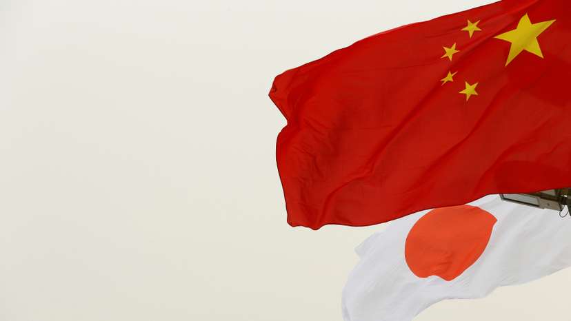 Chinese and Japanese flags flutter in front of the Tiananmen Gate ahead of Japan's Prime Minister Shinzo Abe's visit, in Beijing