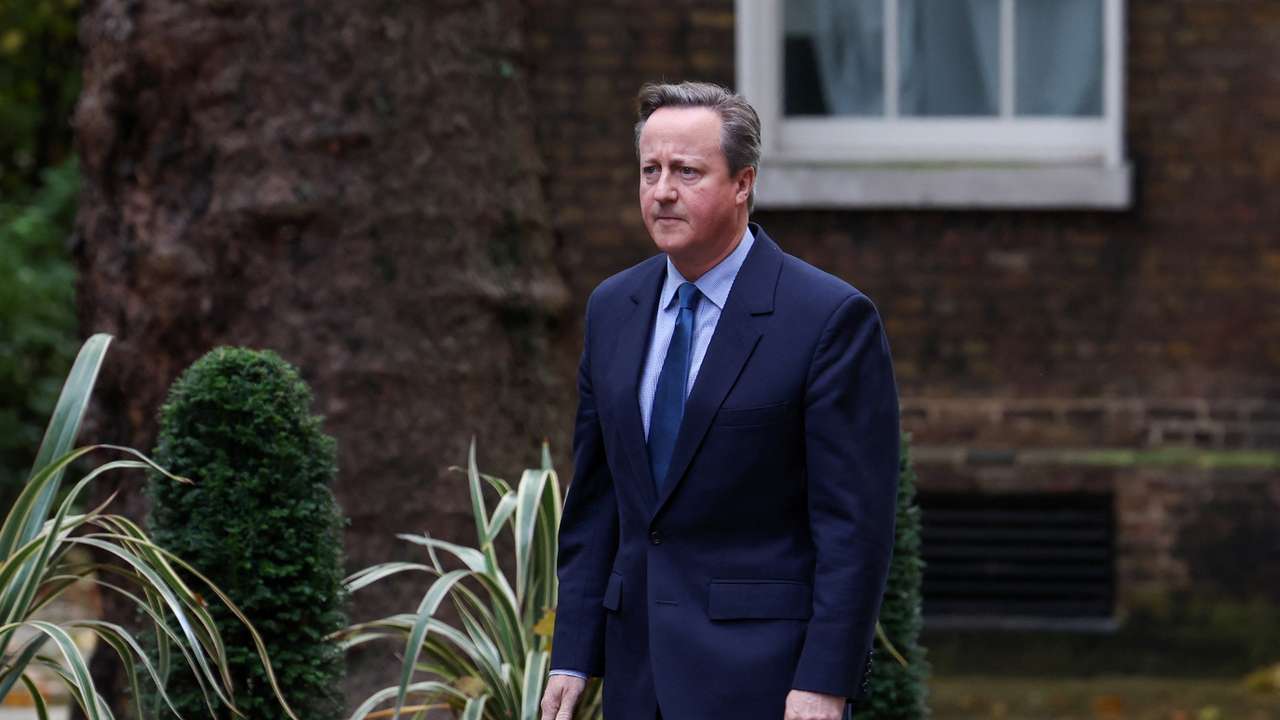 Former British Prime Minister David Cameron walks outside 10 Downing Street in London