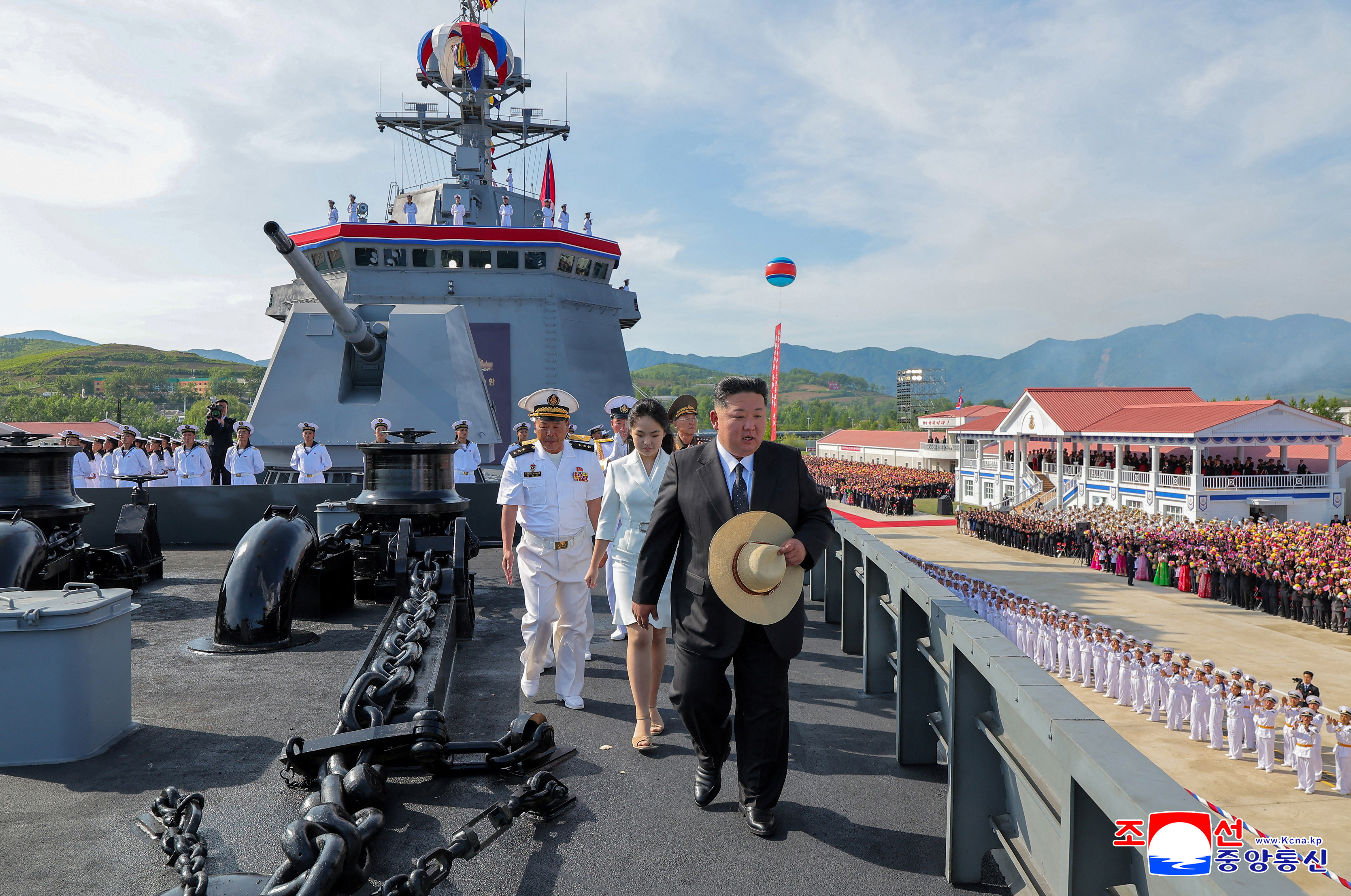 North Korean leader Kim Jong Un attends the launching ceremony of a warship that had been damaged upon its first attempt to launch