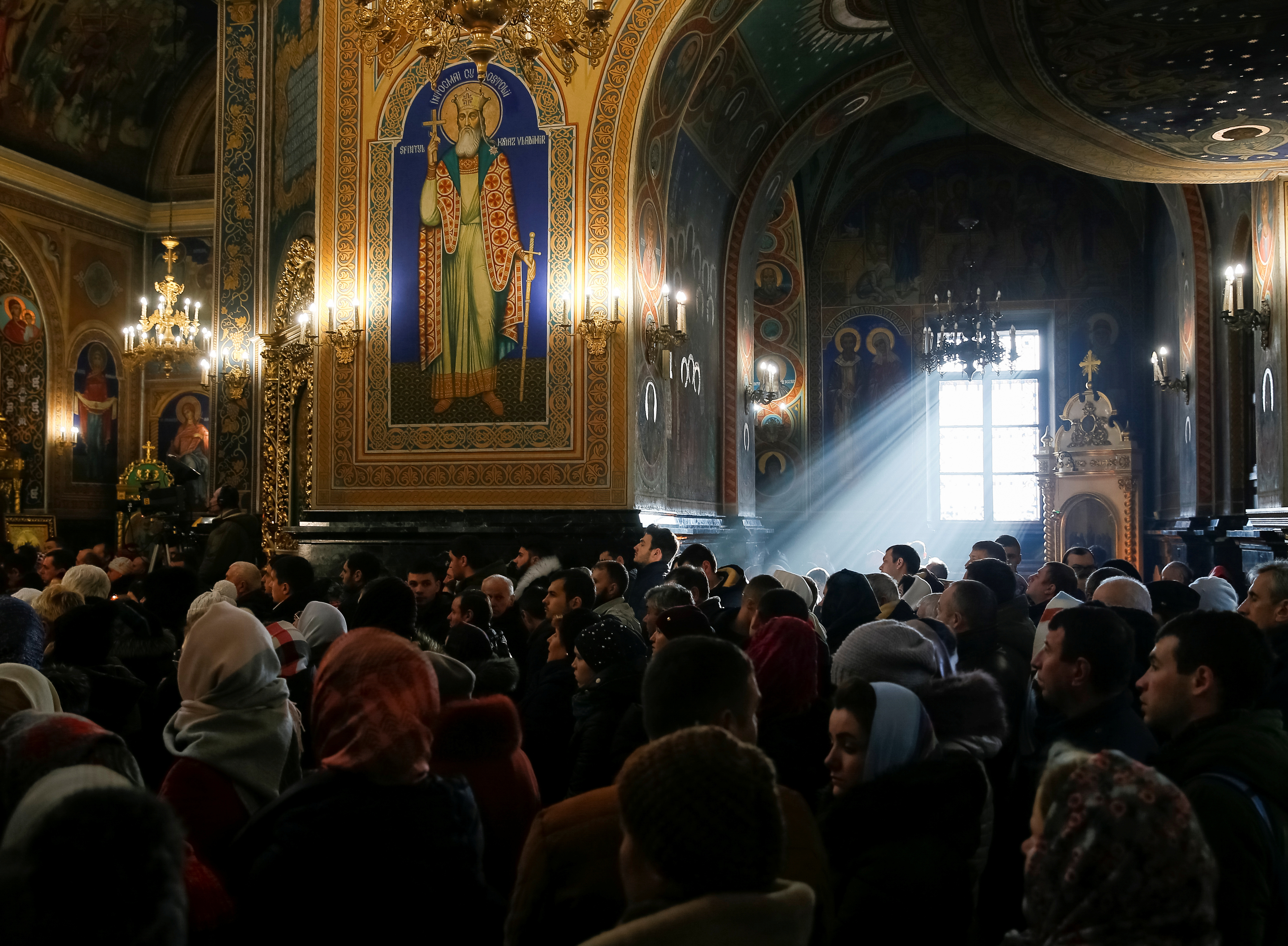 People attend a service for Orthodox Epiphany celebrations in Chisinau