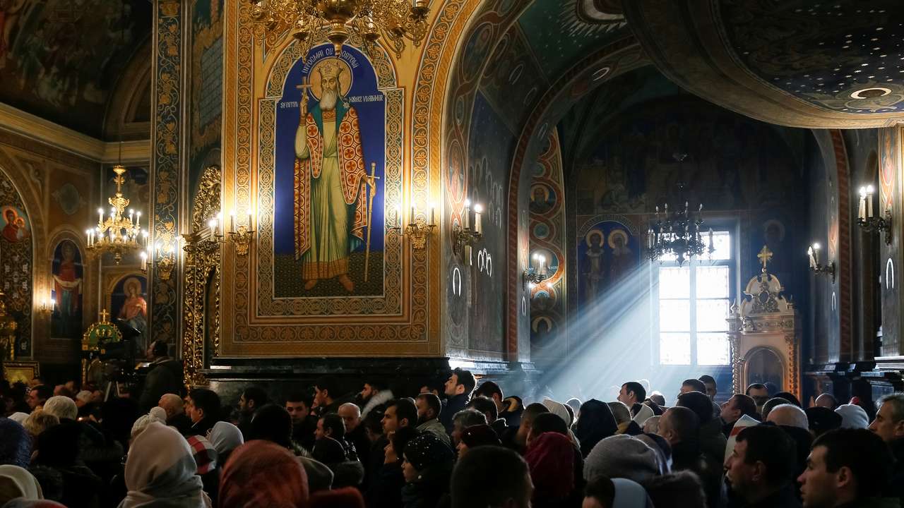 People attend a service for Orthodox Epiphany celebrations in Chisinau