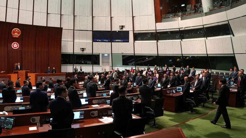 Hong Kong Chief Executive John Lee enters the chamber after the Basic Law Article 23 is passed