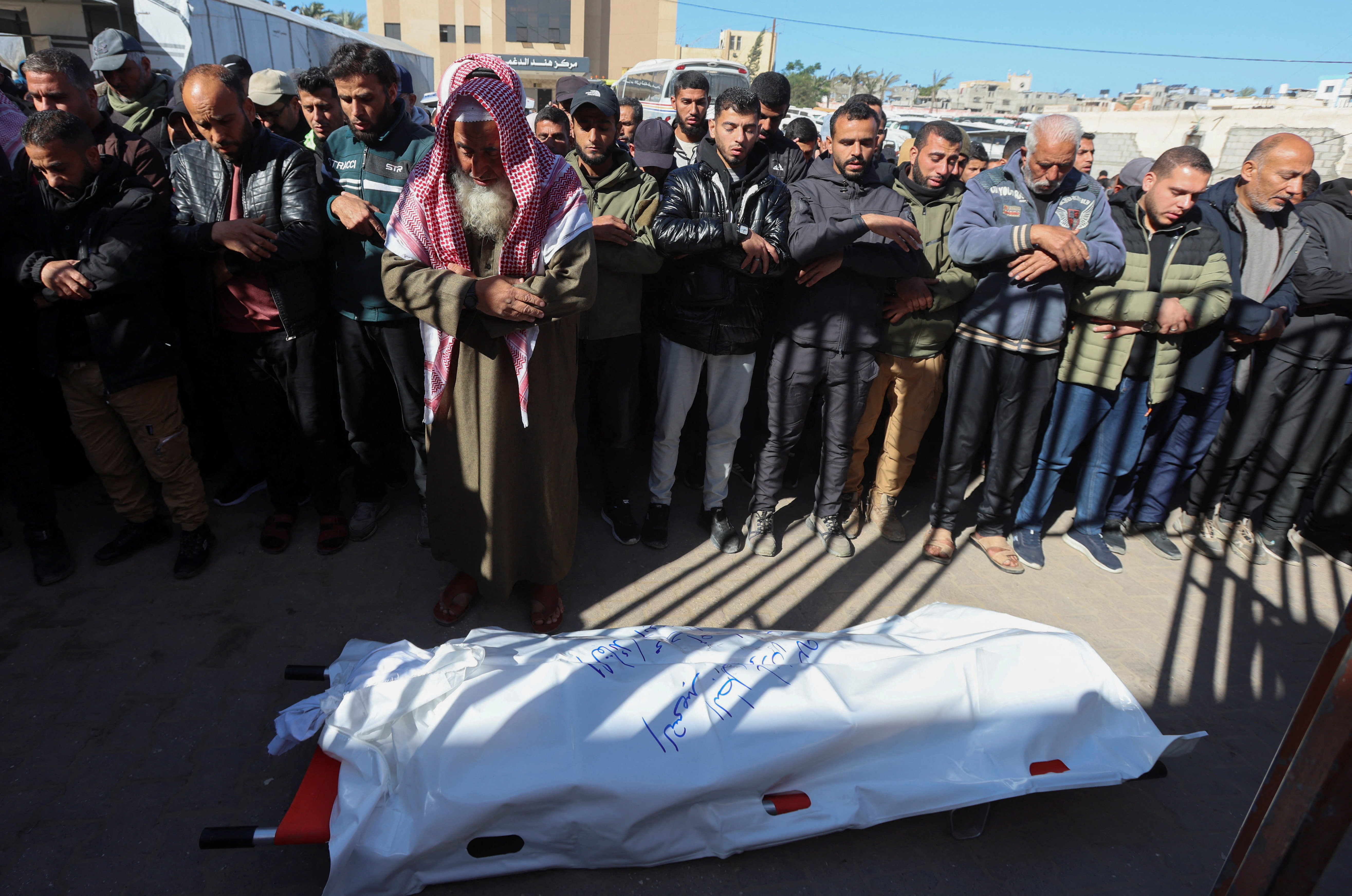 Mourners perform funeral prayers for senior Hamas police officer Mahmoud Al-Astal, who was killed on Monday, at Nasser Hospital in Khan Younis