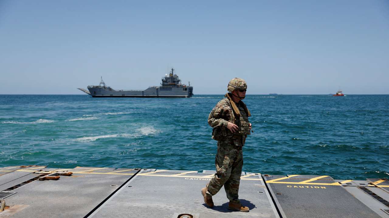 FILE PHOTO: Soldiers stand at Trident Pier