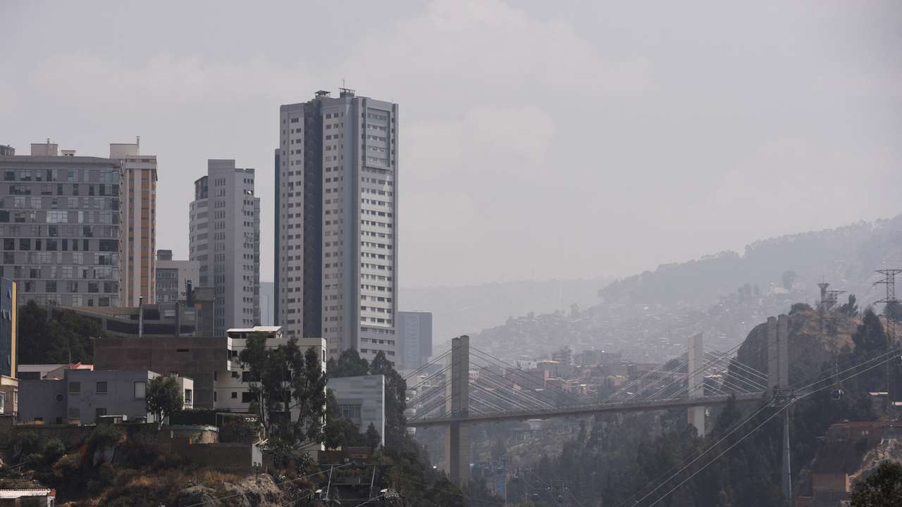 A smoky shroud from wildfires engulfs La Paz