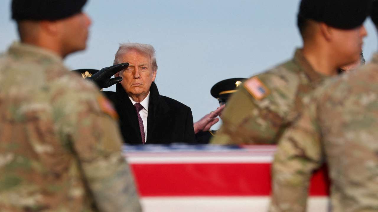 U.S. President Donald Trump participates in a dignified transfer of the remains of two Iowa National Guard members, in Dover