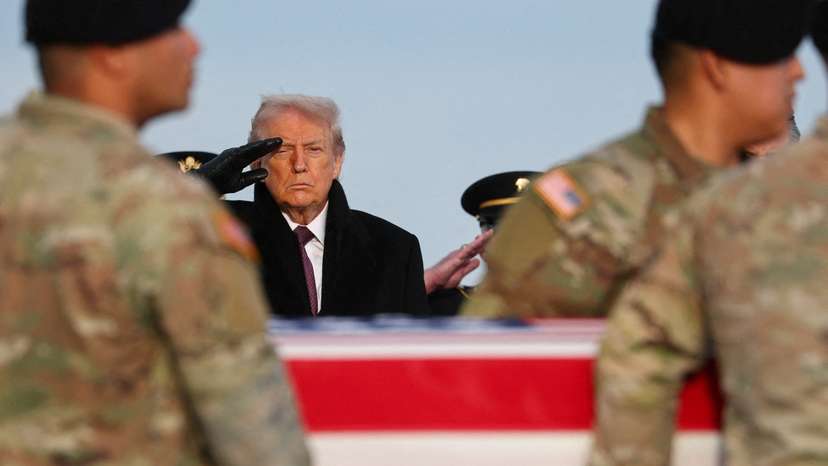 U.S. President Donald Trump participates in a dignified transfer of the remains of two Iowa National Guard members, in Dover