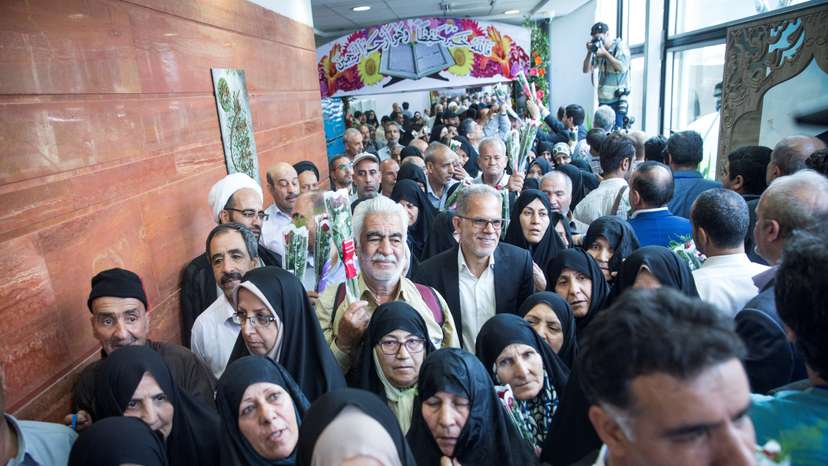 FILE PHOTO: Iranian pilgrims wait at the Imam Khomeini Airport as they depart for the annual haj pilgrimage to the holy city of Mecca, in Tehran