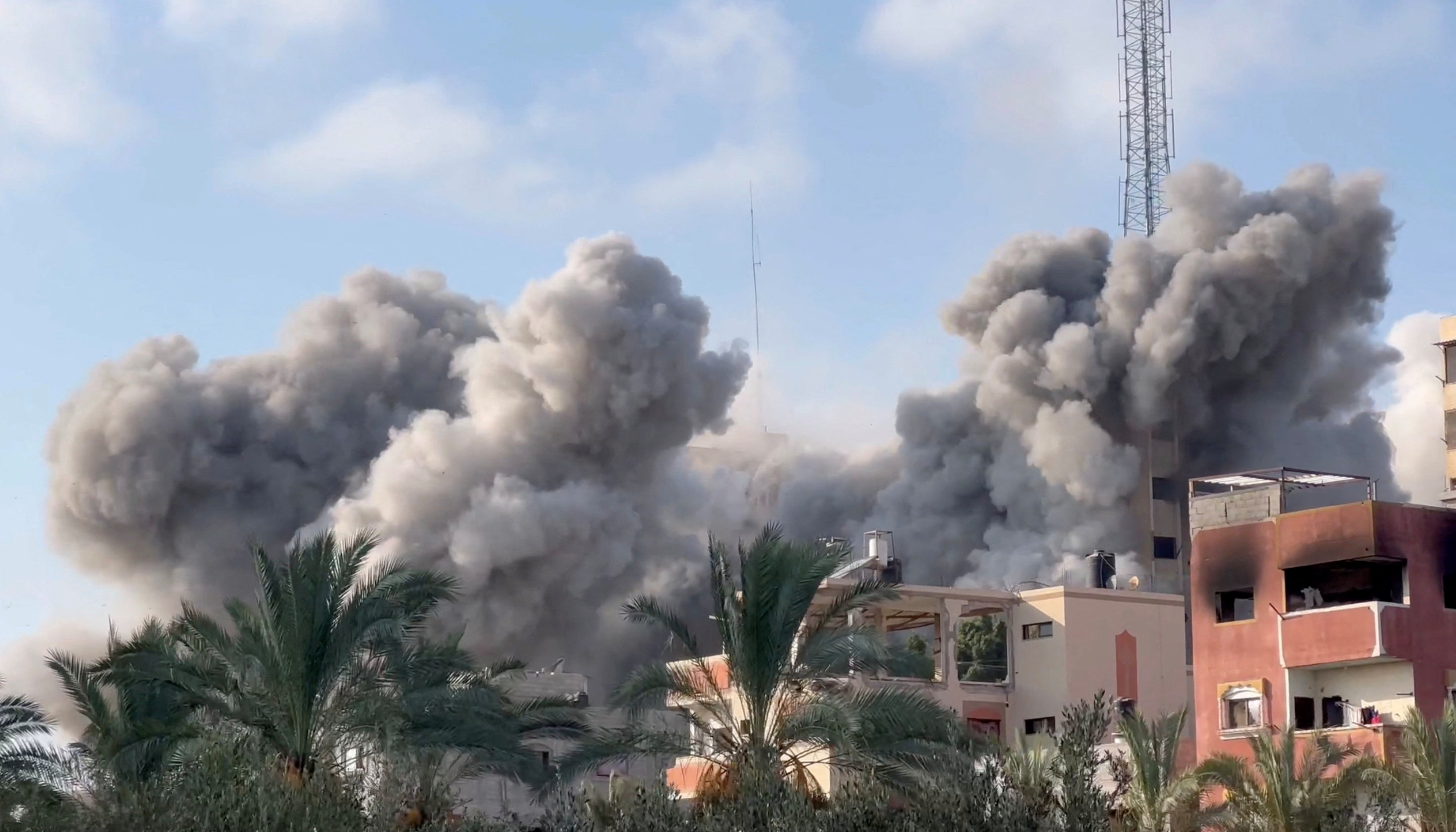 Smoke rises following an Israeli strike on a residential building, amid the ongoing conflict between Israel and Hamas