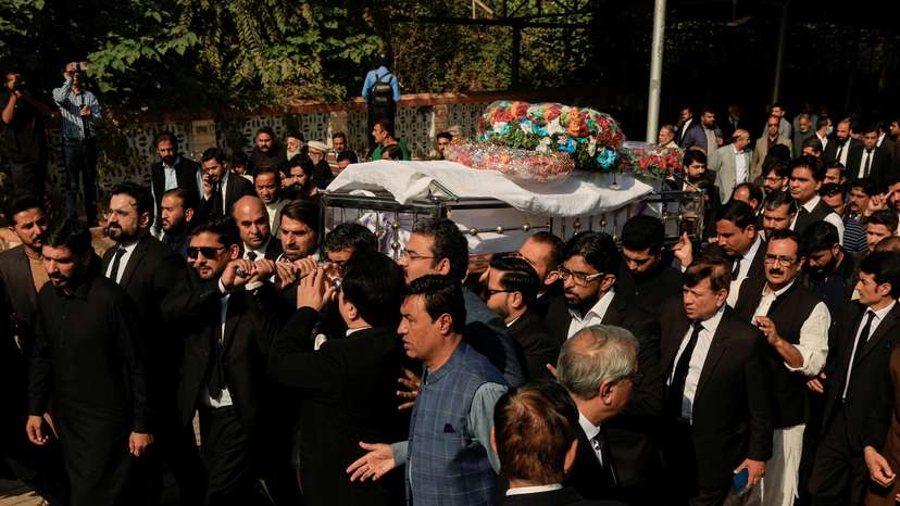 Lawyers carry the coffin of Zubair Aslam Ghuman, a lawyer who was killed yesterday in a blast, outside district court building, as they attend a funeral in Islamabad