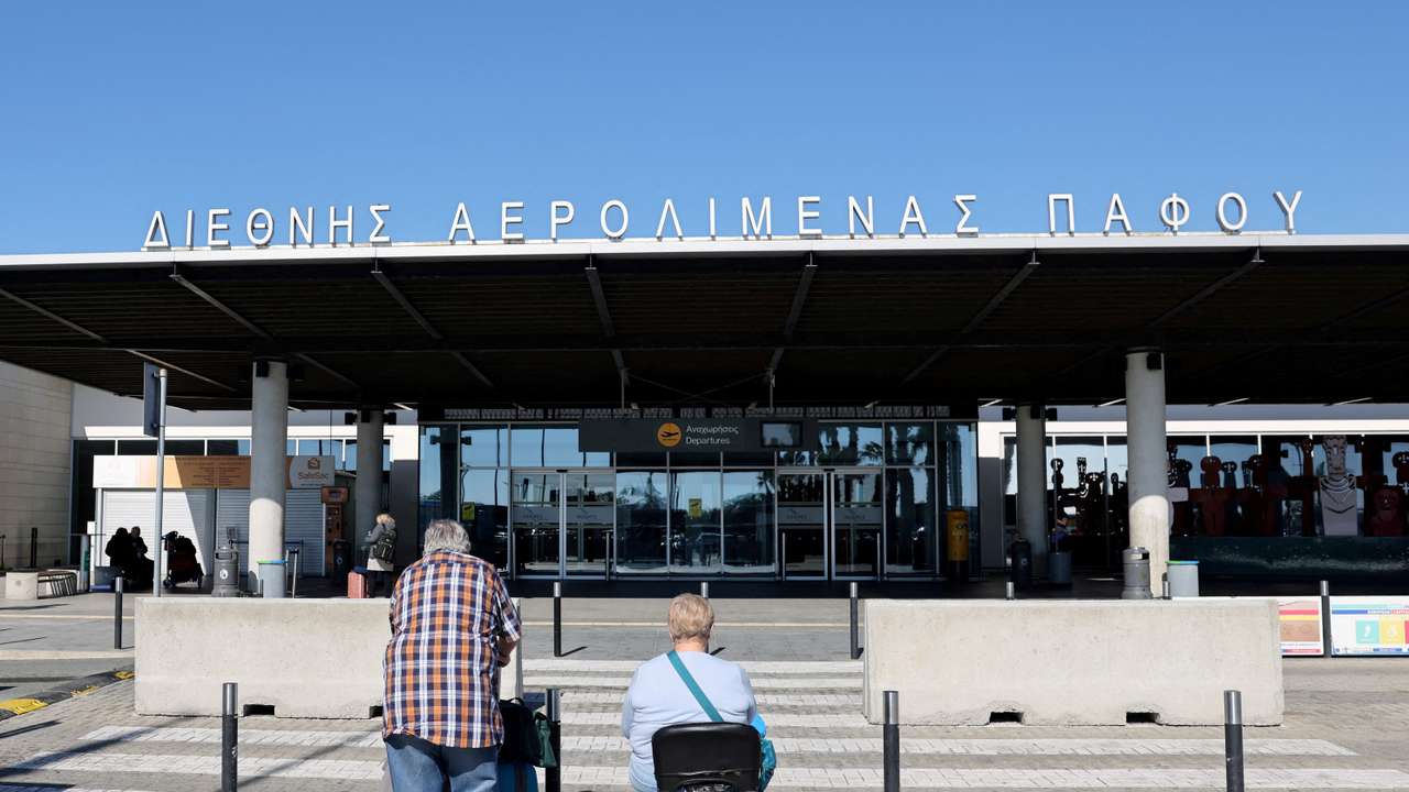 Tourists approach Paphos International Airport with their luggage in Paphos