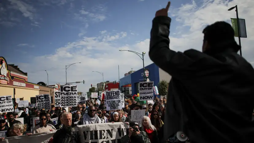 People gather for a protest against ICE raids in Little Village, Chicago
