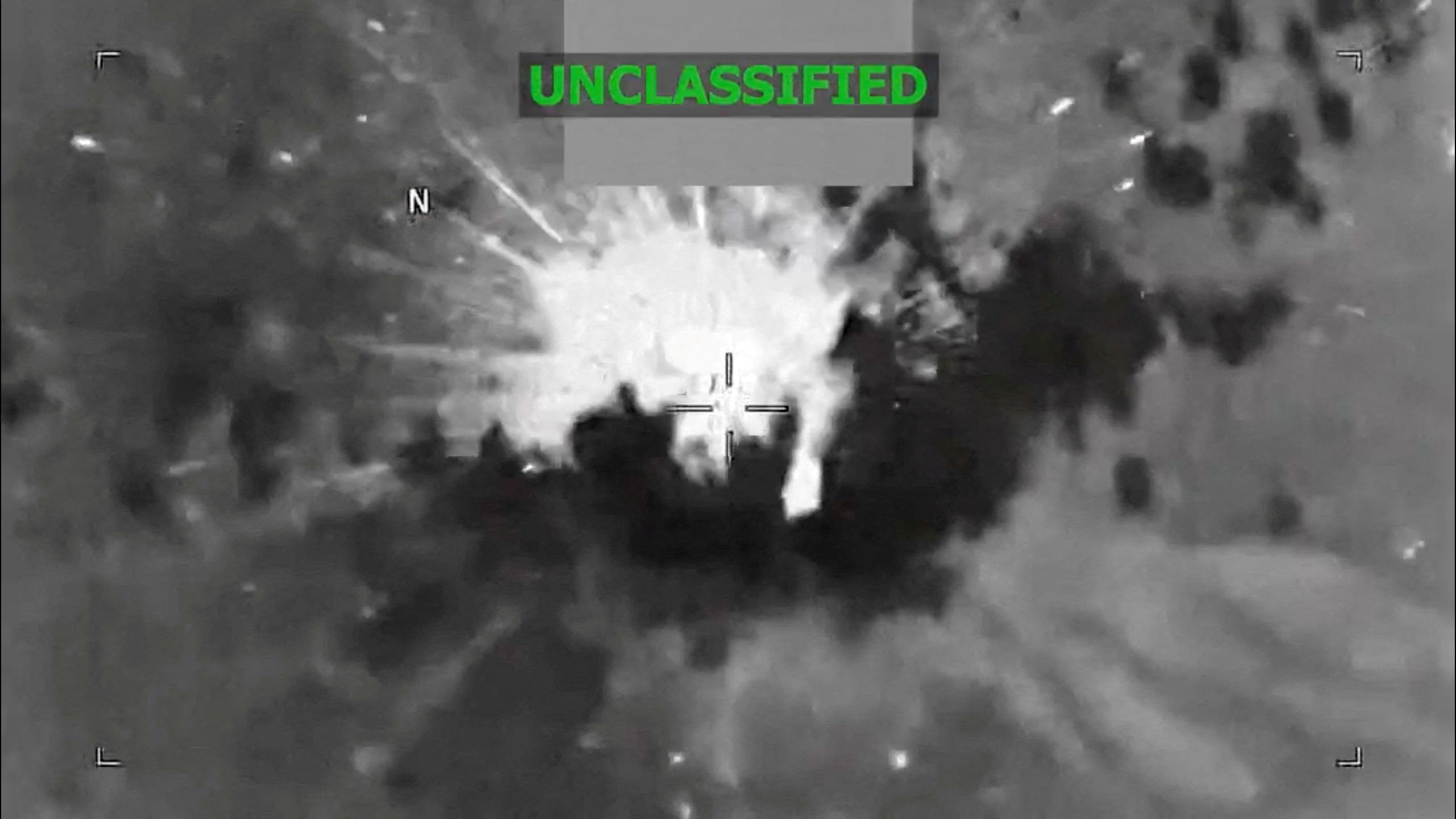 An explosion occurs on a vessel during what the U.S. military says was a kinetic strike on a suspected drug trafficking vessel in the Caribbean